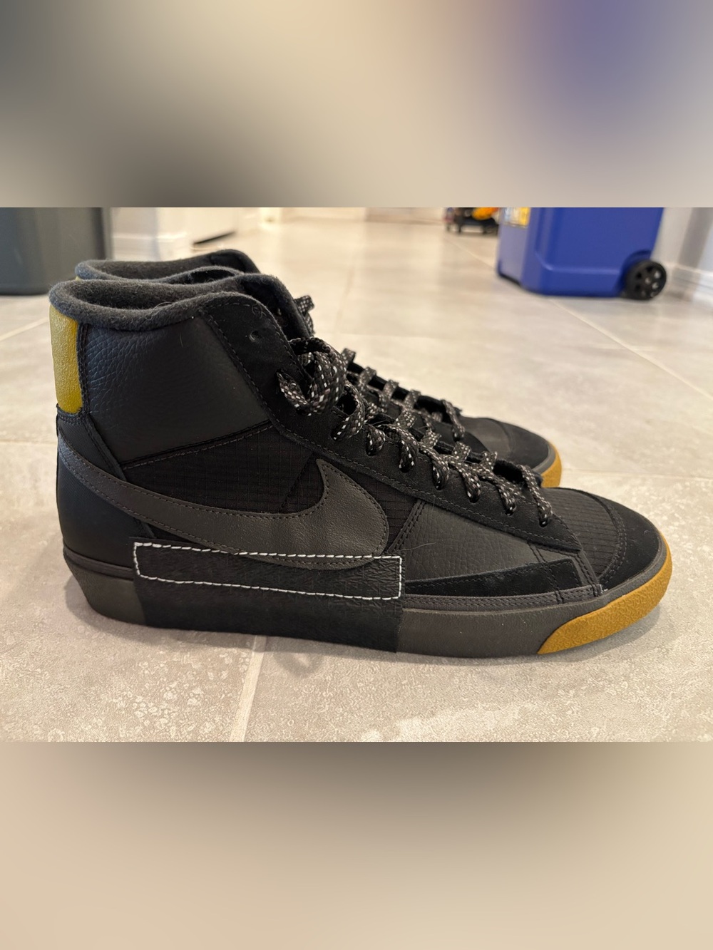 Nike Black High-Top Sneakers with Gold Accents
